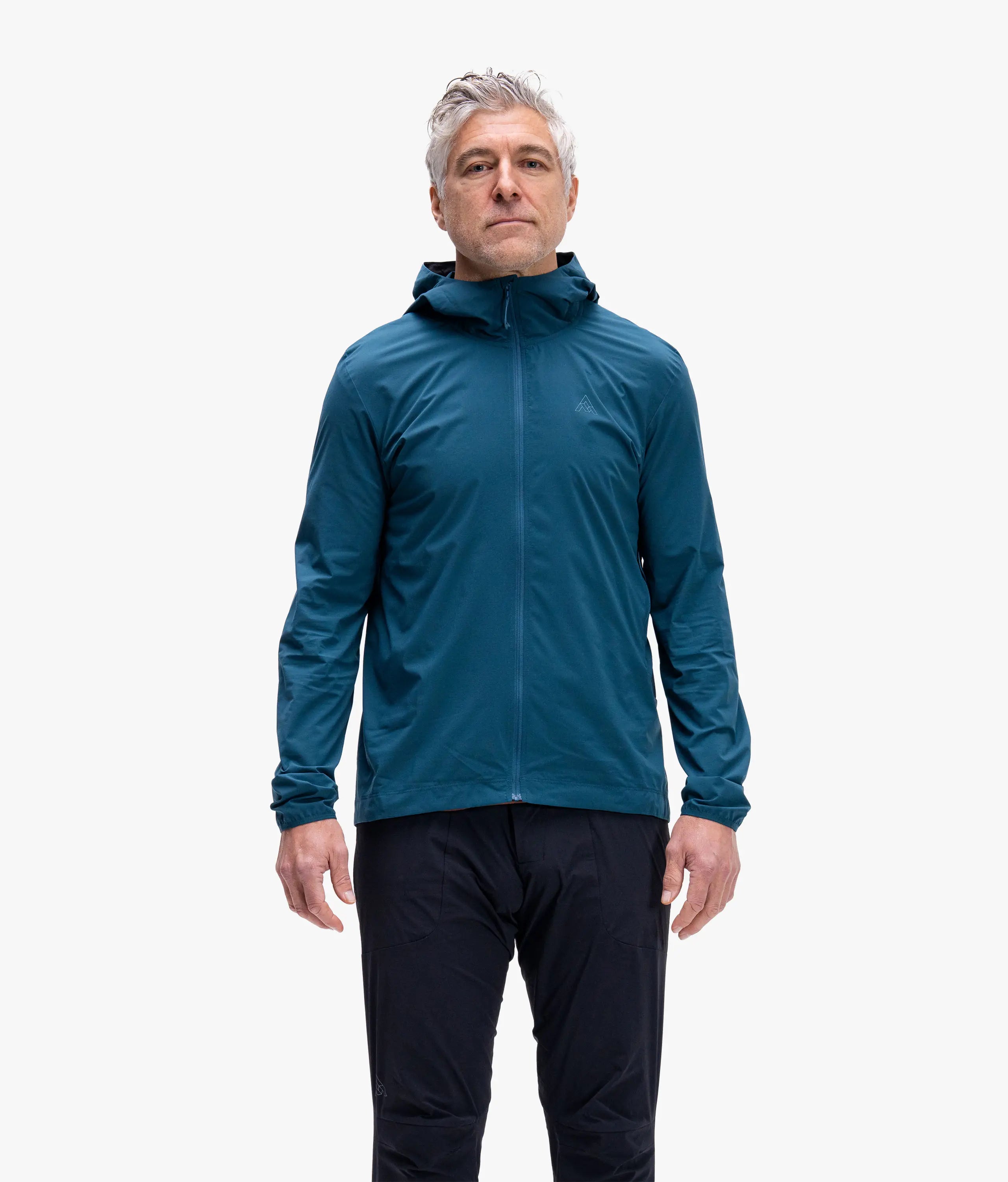 Man wearing a blue jacket on a white background