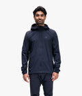 Man wearing a dark blue raincoat on a white background