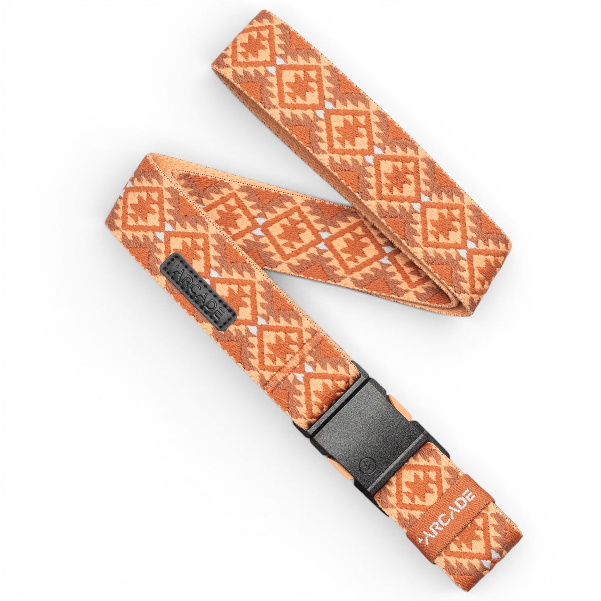 A woven belt with an orange and white geometric pattern, featuring a black plastic buckle and a leather brand tab that reads 'ARCADE'.