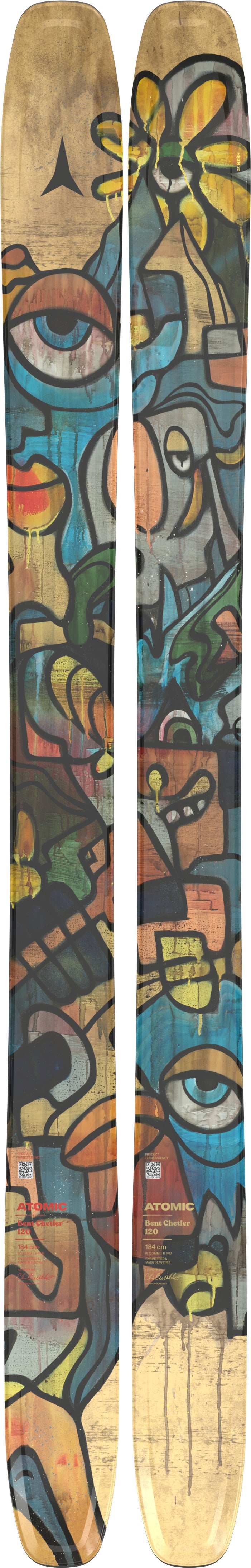 Two wooden skis with colorful abstract designs on a plain background