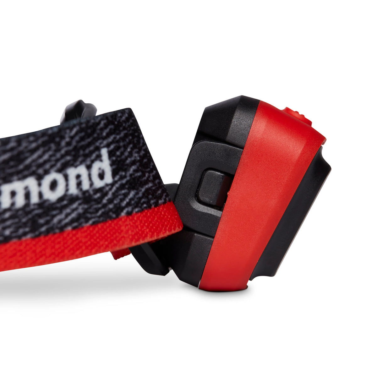 Close-up of a headlamp showing the black and red adjustable strap and the lamp housing on a white background.