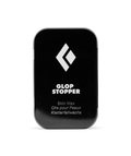 Black container of Glop Stopper skin wax with a white logo on a white background