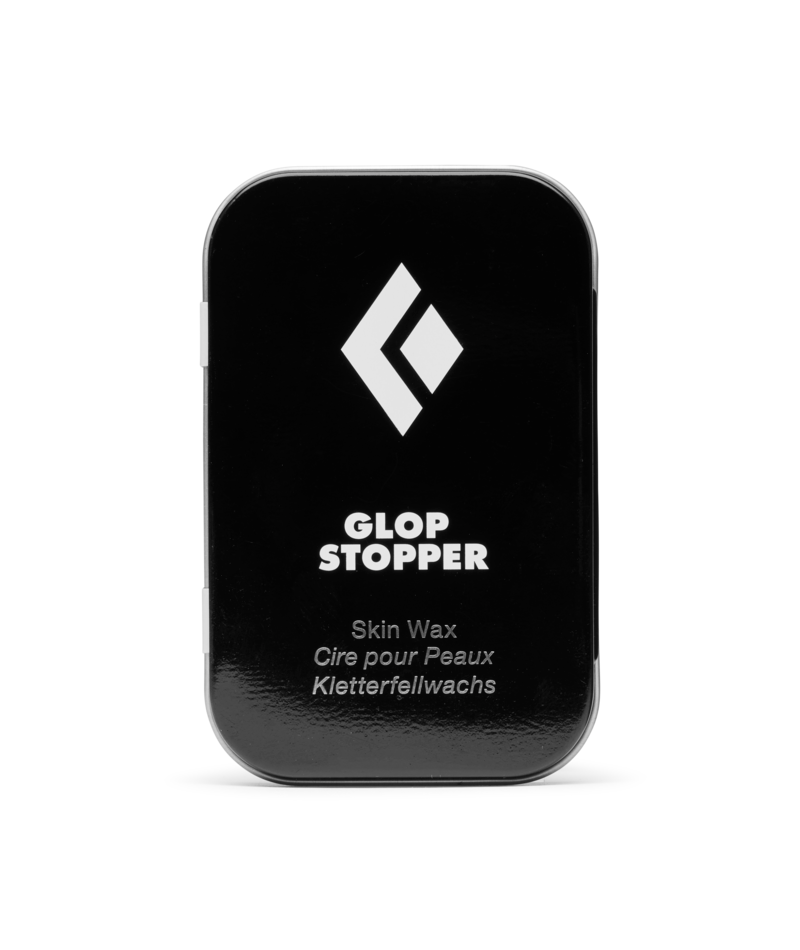 Black container of Glop Stopper skin wax with a white logo on a white background