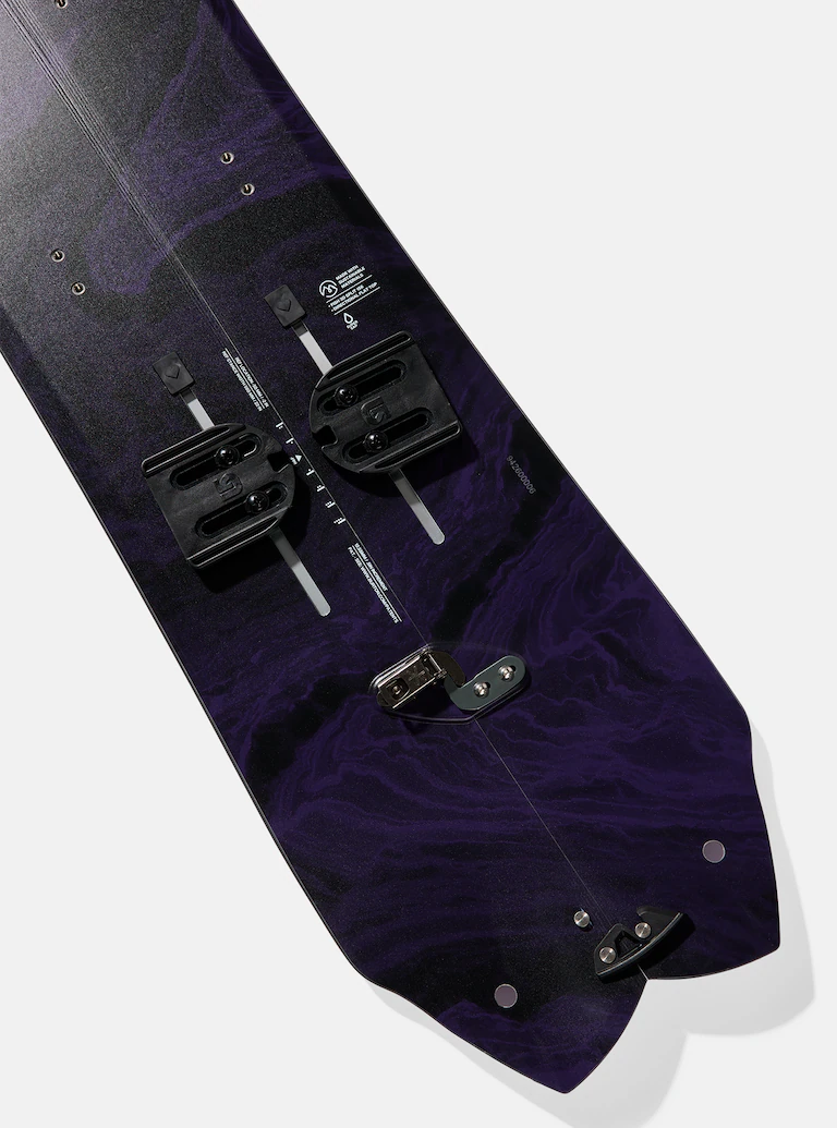 Close-up of a snowboard with a purple and black design on a white background