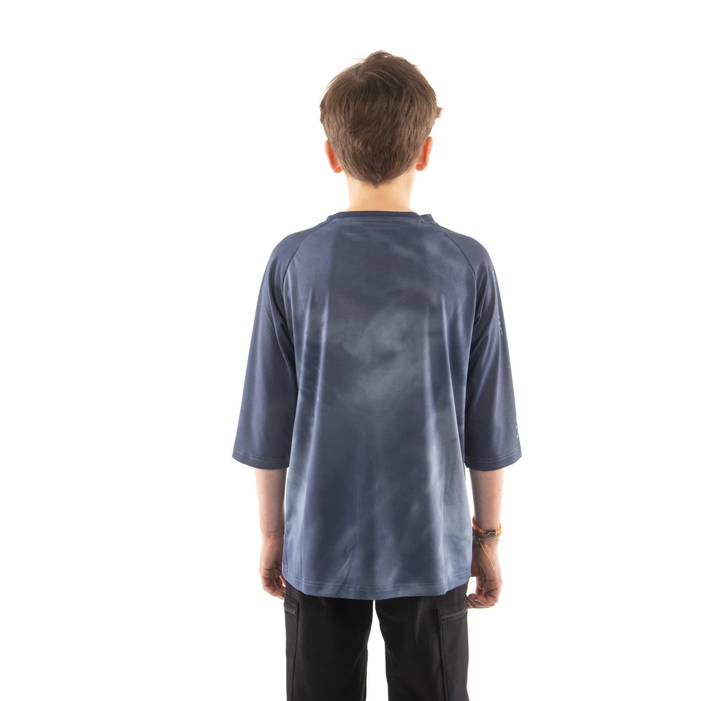 Person wearing a blue tie-dye shirt from behind on a white background