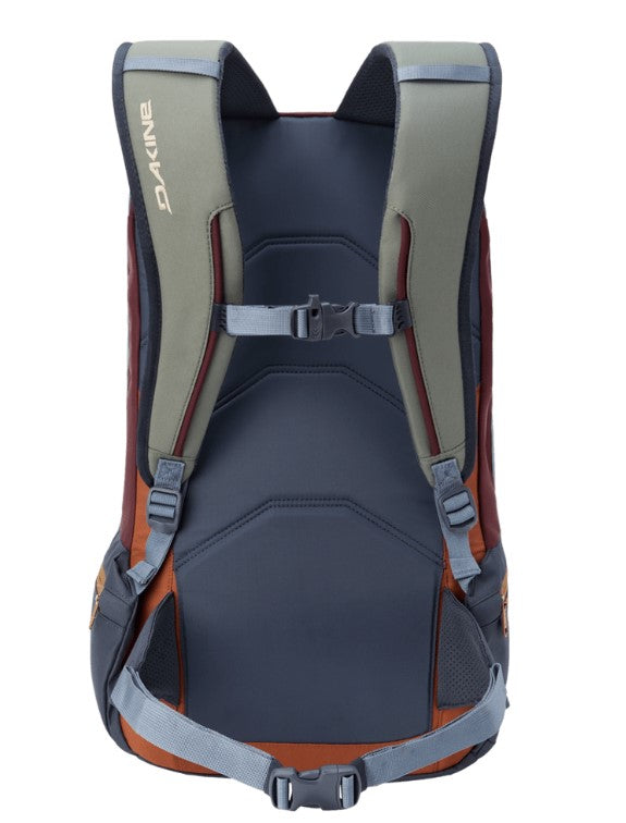 Back view of a Dakine backpack with orange and gray straps on a white background