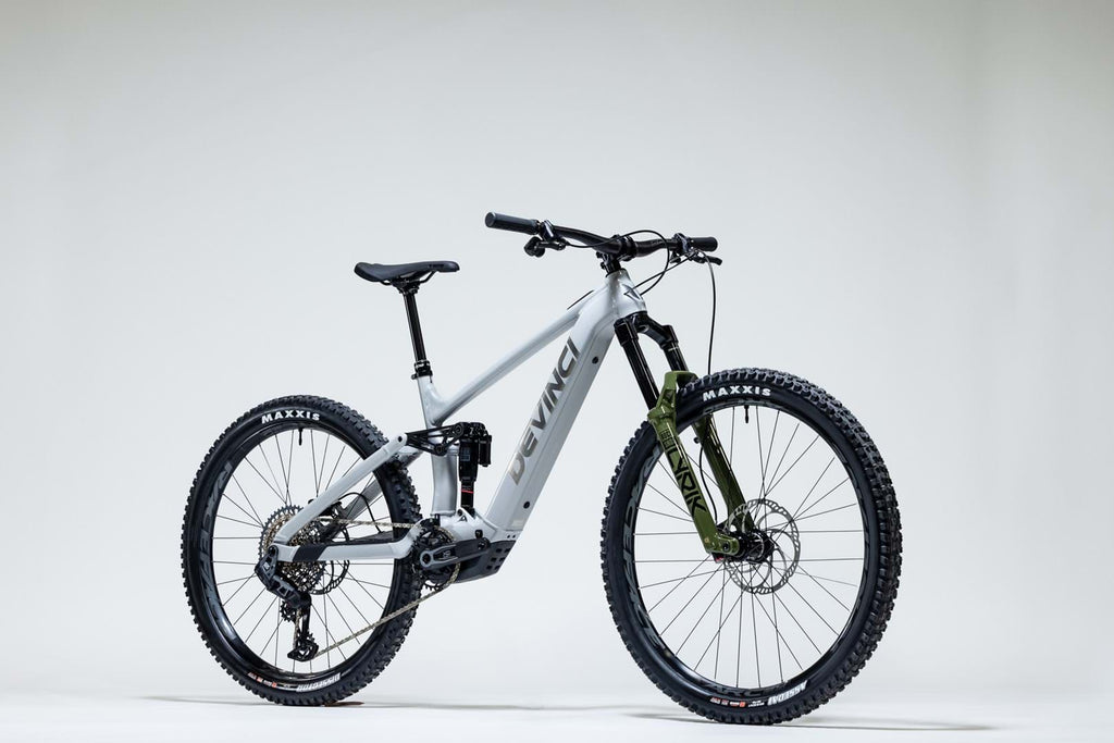 White mountain bike with black components on a white background
