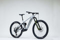 White mountain bike with black components on a white background