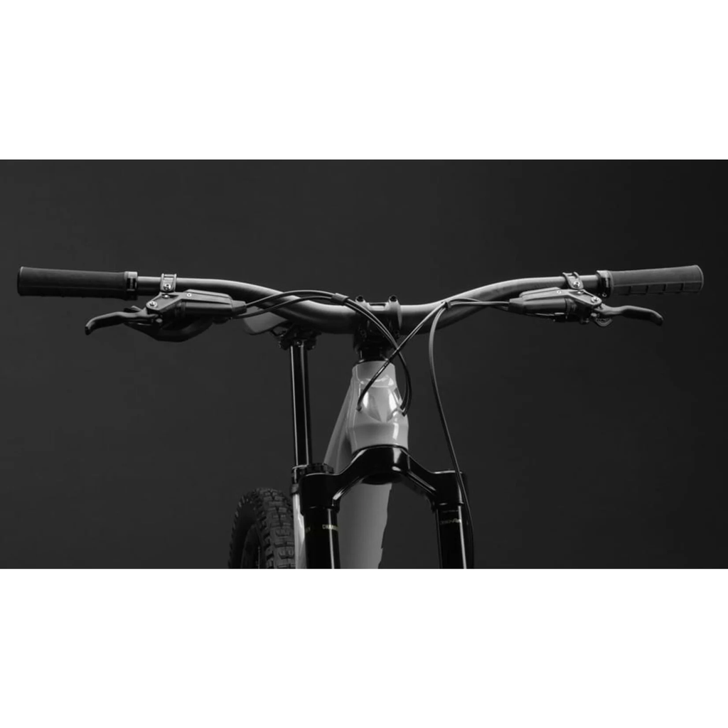 Close-up of a bicycle handlebar with a black background