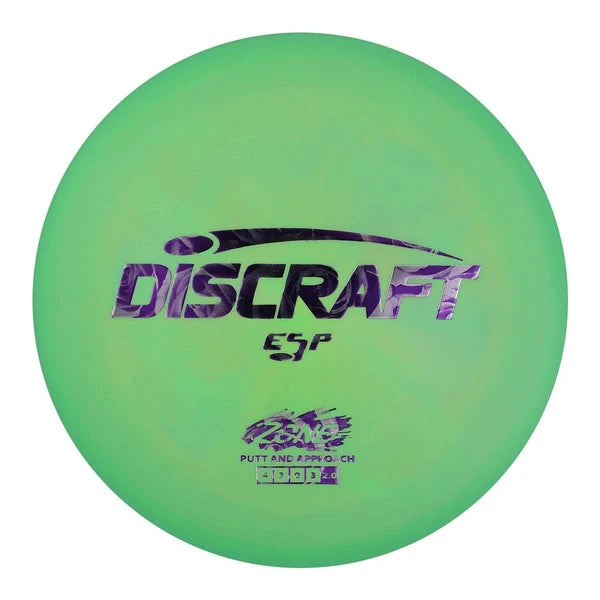 A green Discraft ESP putter disc golf disc with purple foil stamping on a white background.