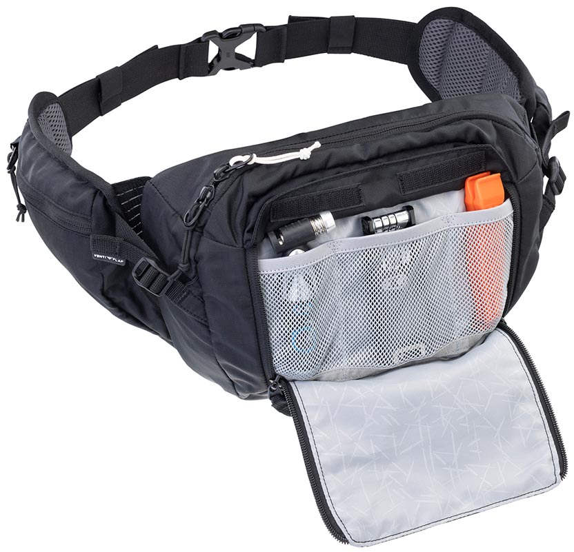 A black and gray fanny pack/waist bag with an open front pocket showing storage compartments, mesh pockets, and small accessories inside, photographed on a white background.