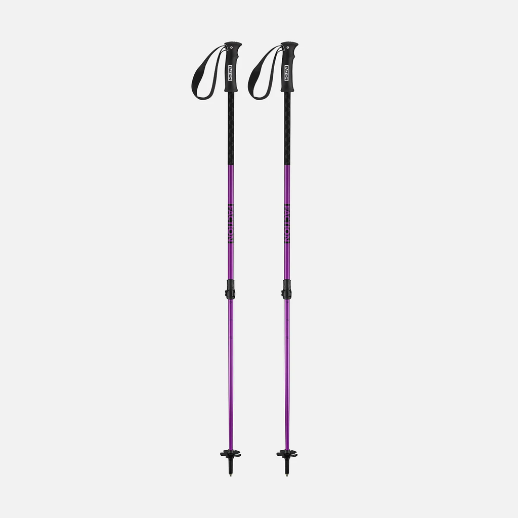 Two purple and black ski poles on a light gray background