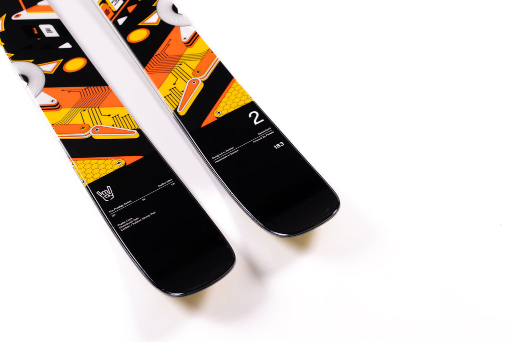 Two skis with colorful designs on a white background