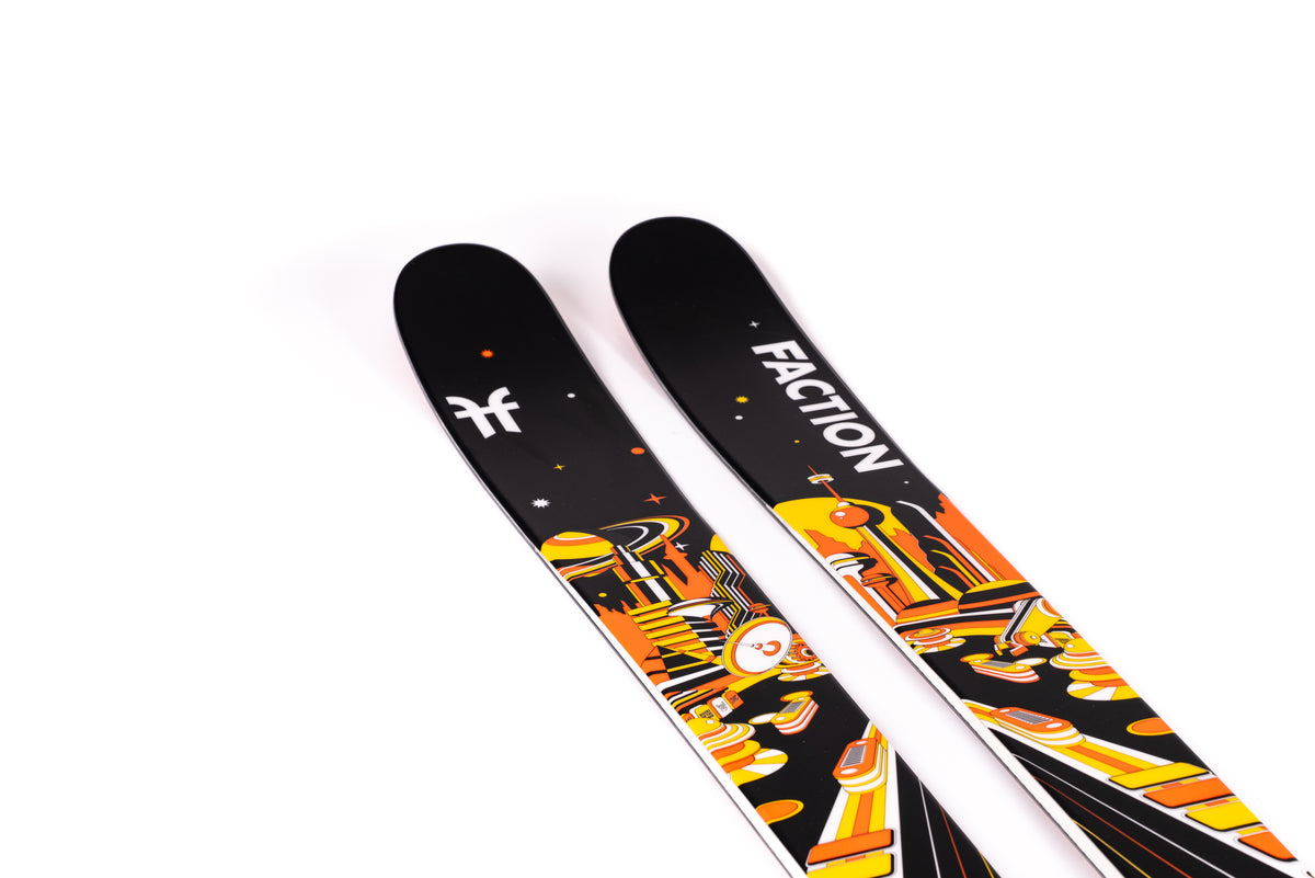 Two Faction skis with a colorful design on a white background
