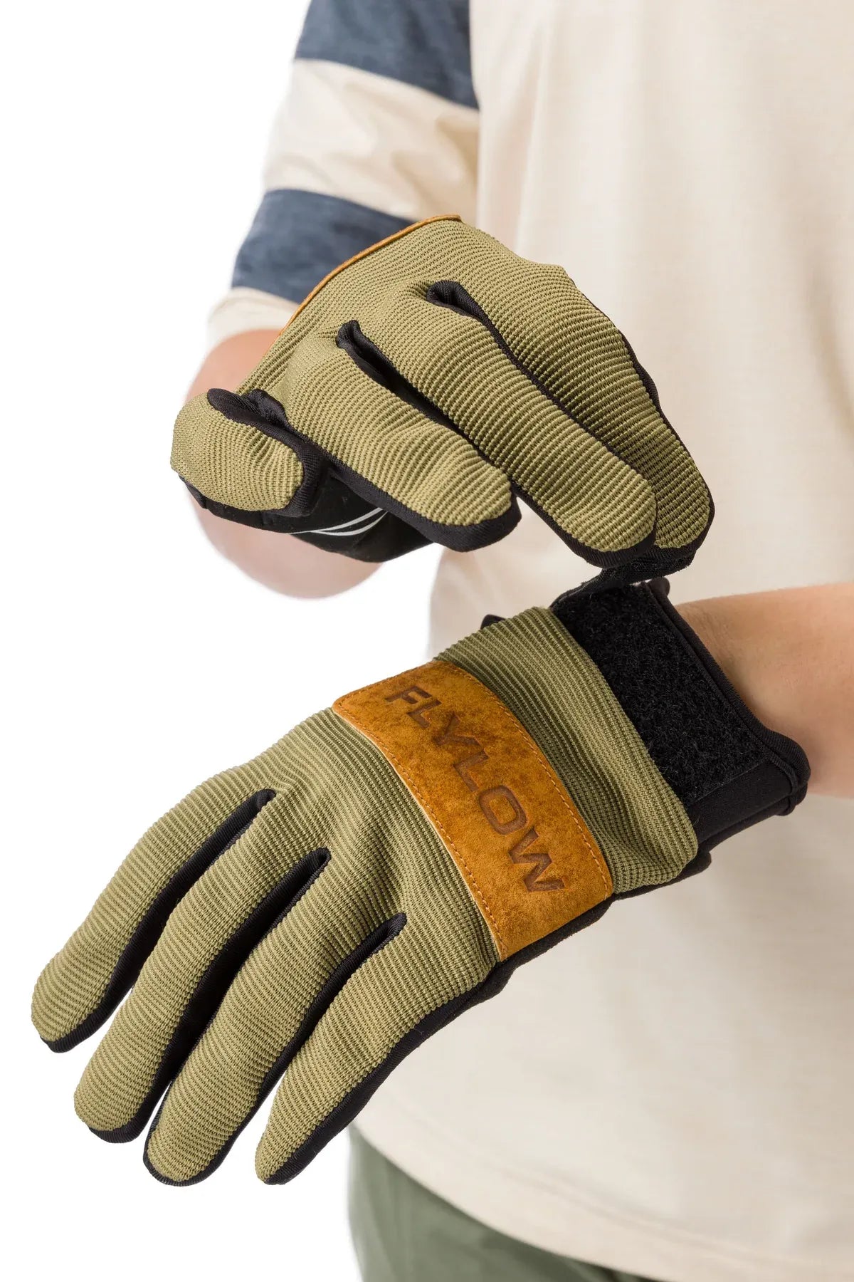 Green mountain biking gloves with brown patch on a white background