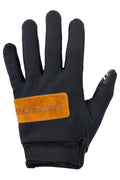 Black glove with orange Flylow logo on a white background