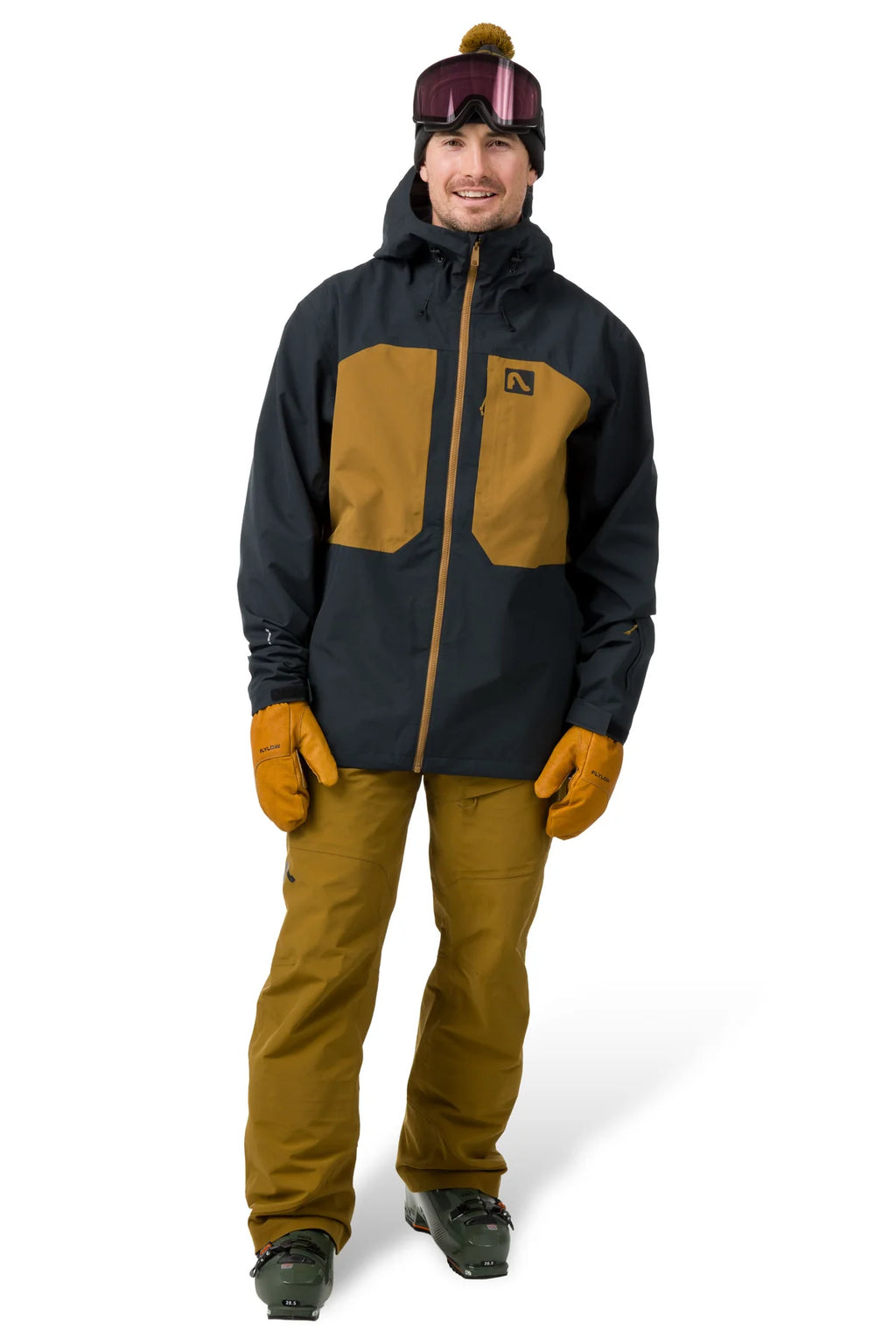 Person wearing a black and brown jacket with matching pants on a white background