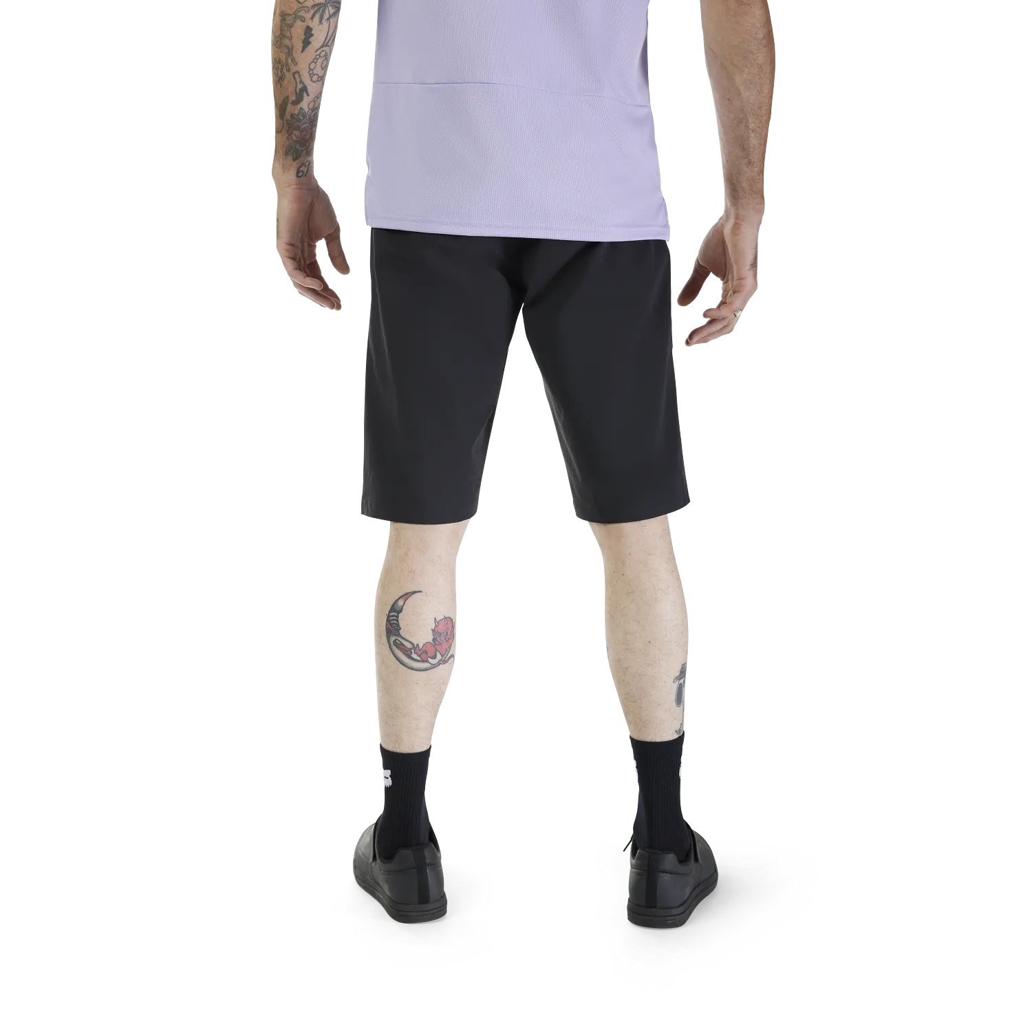 Person wearing black shorts on a white background