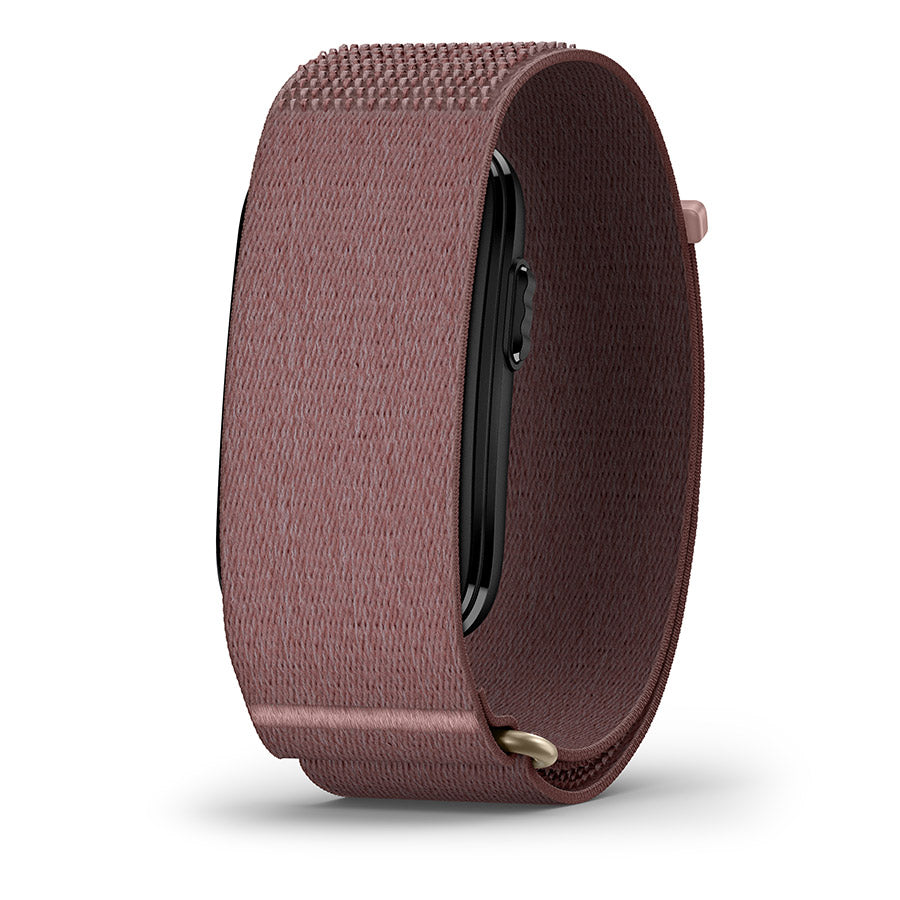 A close-up of a smartwatch band in a dusty rose or mauve-brown nylon fabric, shown on a white background with a soft shadow.