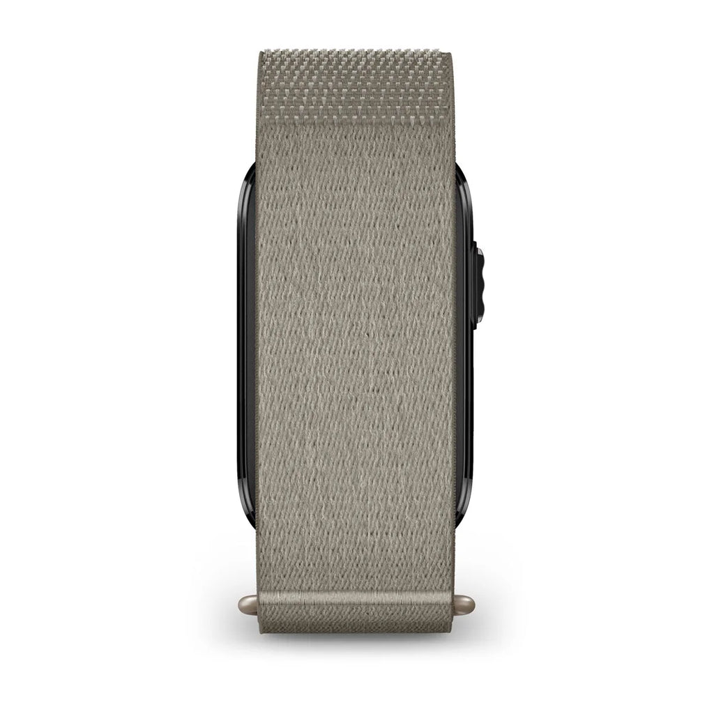 A light gray woven fabric watch band attached to a smartwatch, shown from the side against a plain white background.
