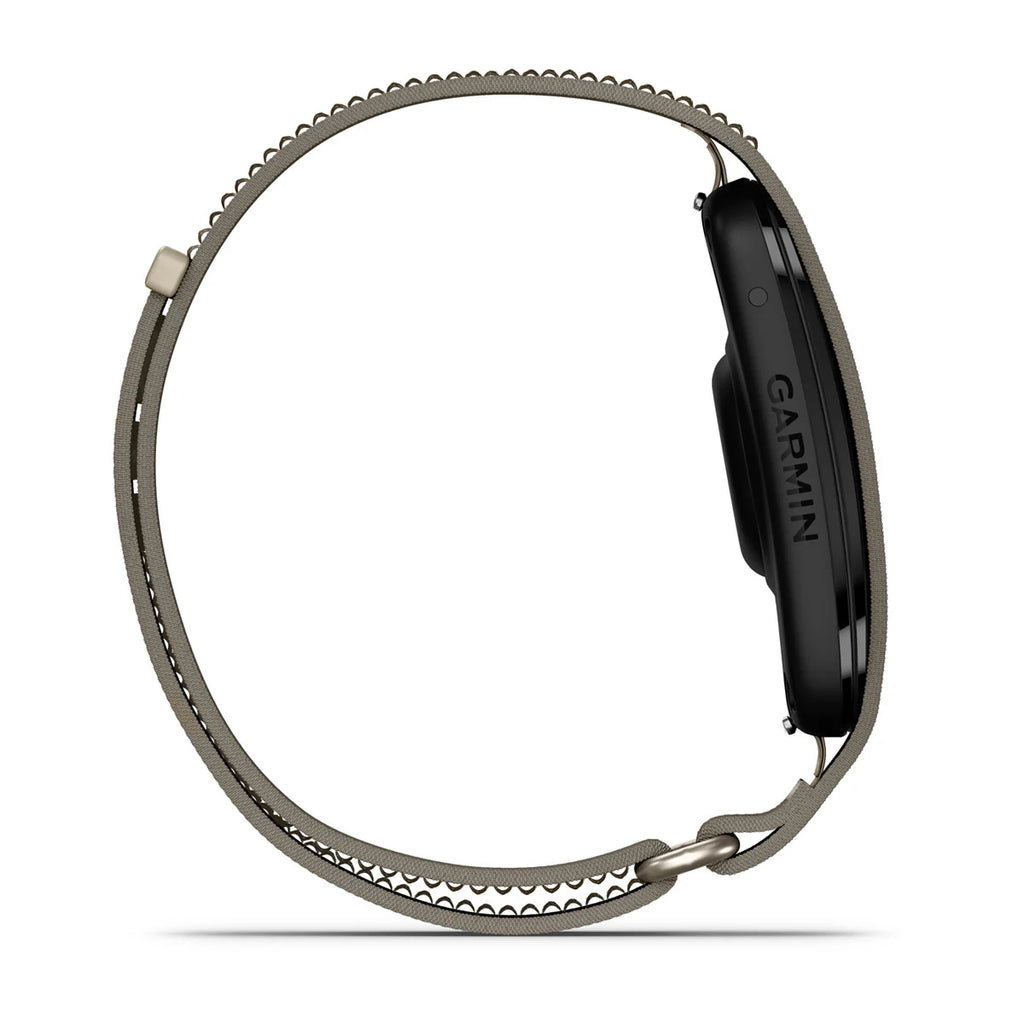 A side profile view of a Garmin smartwatch with a dark gray metallic loop band on a solid white background.