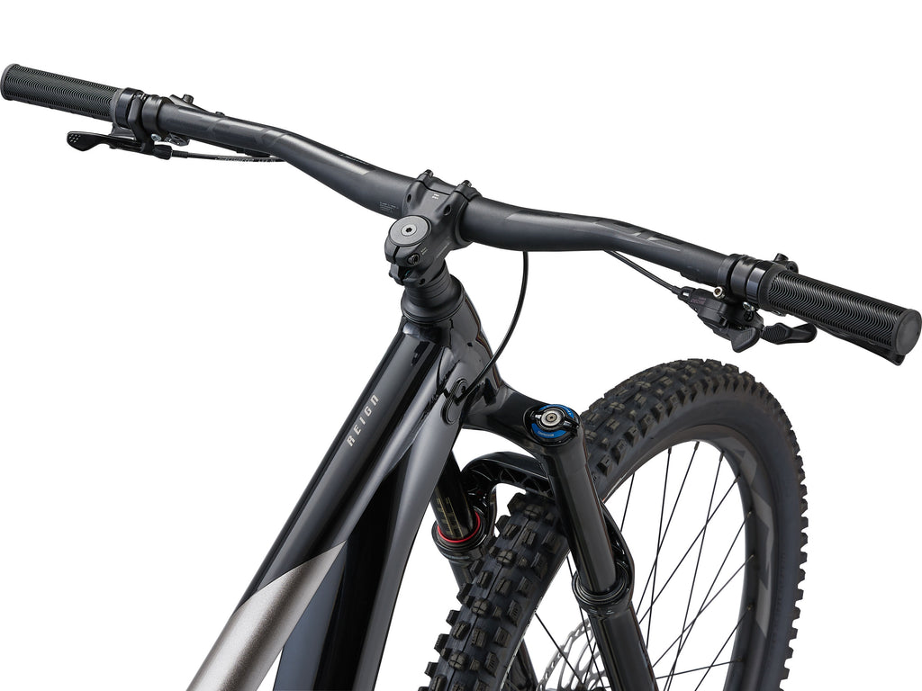 Close-up of a bicycle handlebar and front wheel on a white background