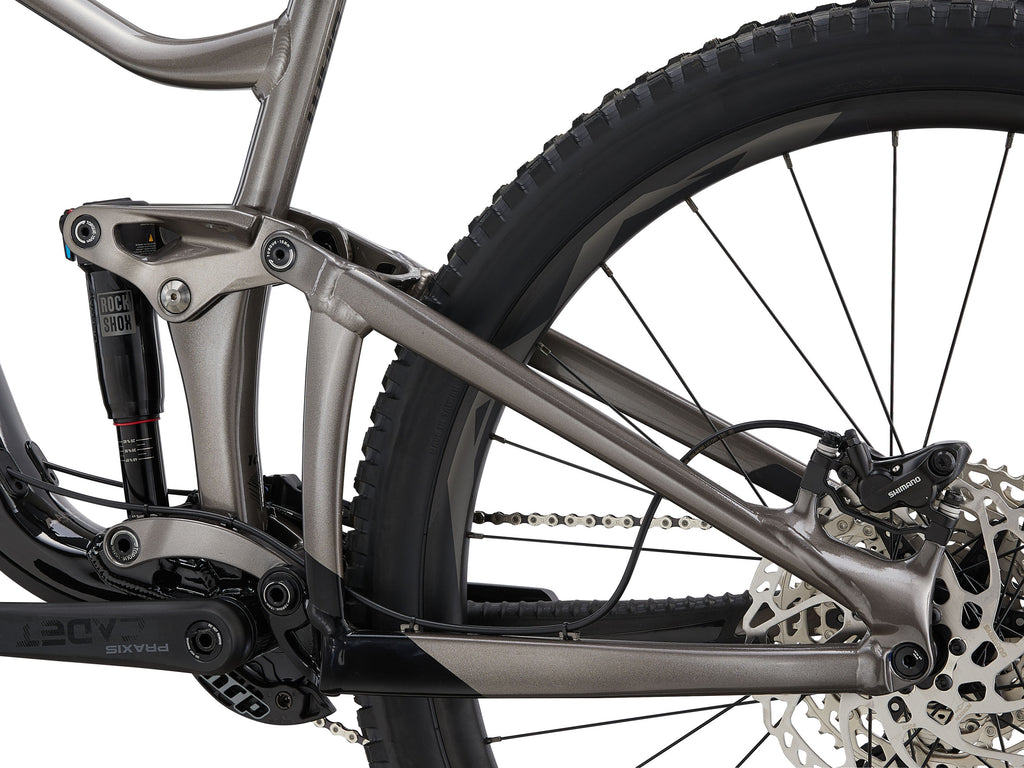 Close-up of a mountain bike frame with suspension fork on a white background