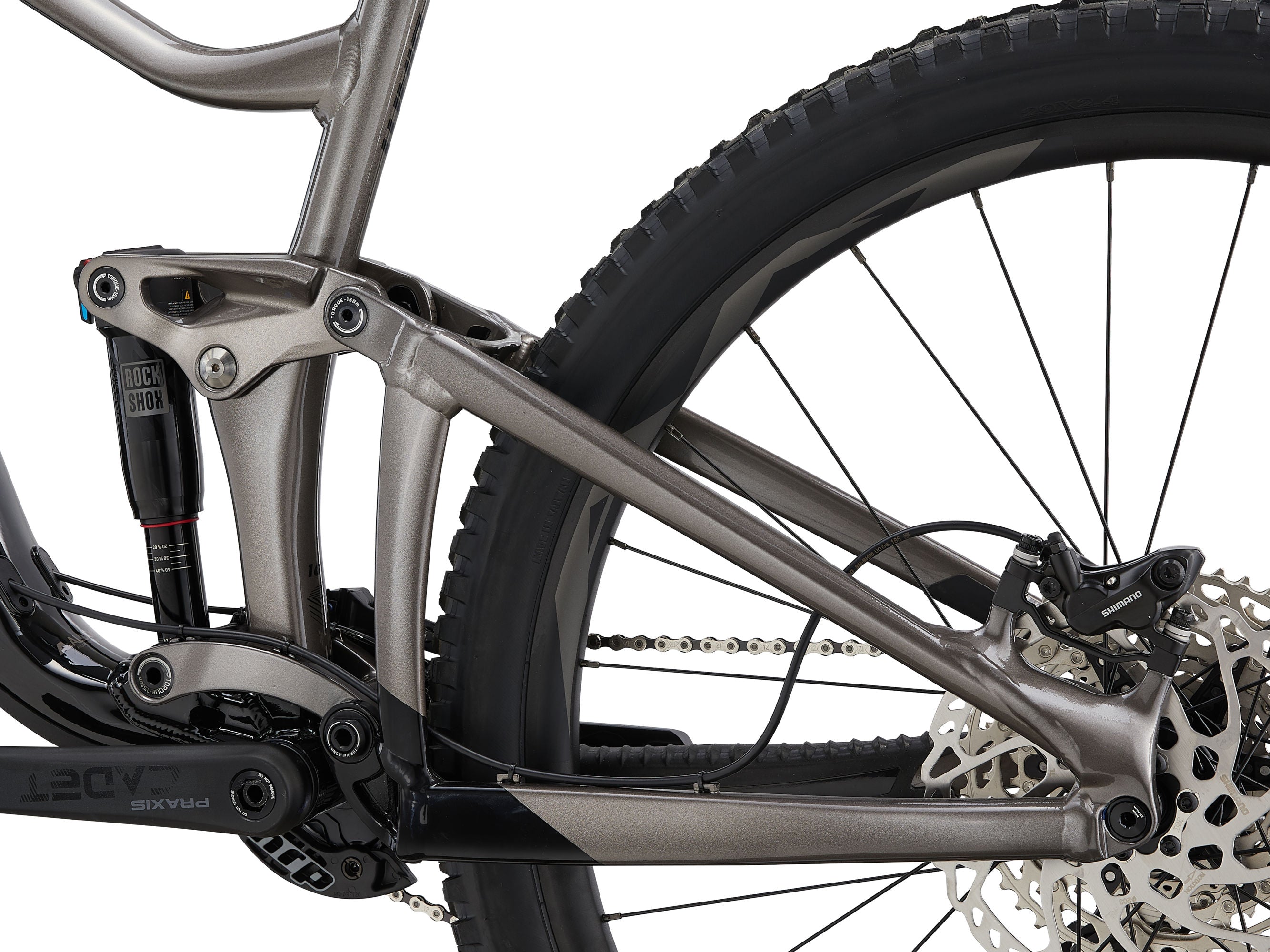 Close-up of a mountain bike frame with suspension fork on a white background