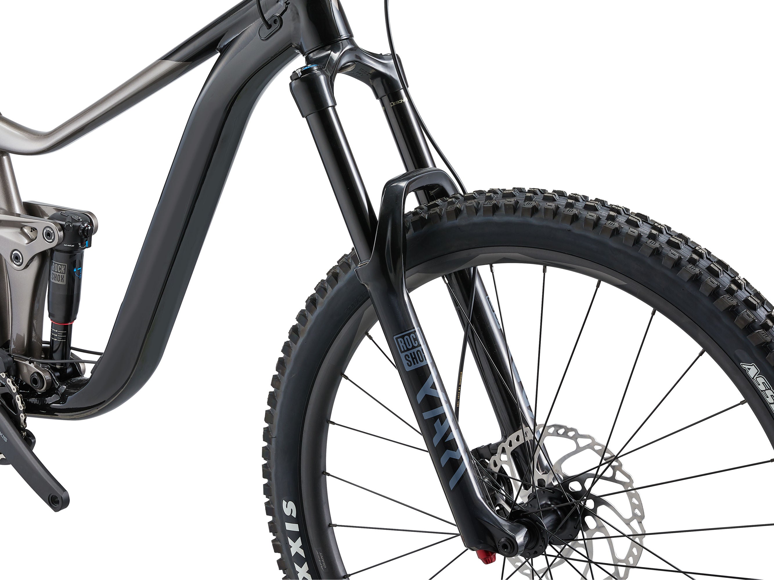 Close-up of a black mountain bike with visible brand logos on a white background