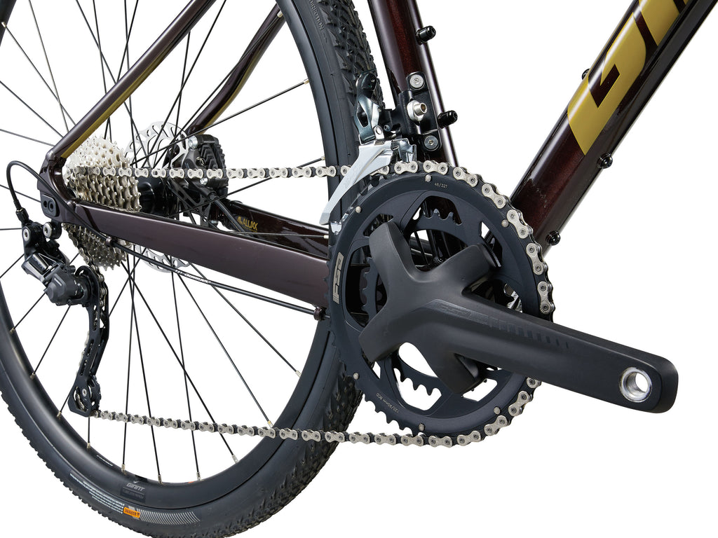 Close-up of a bicycle chain and gear system on a white background