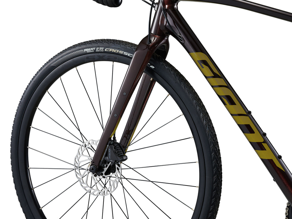 Close-up of a bicycle wheel with 'Giant' branding on a white background