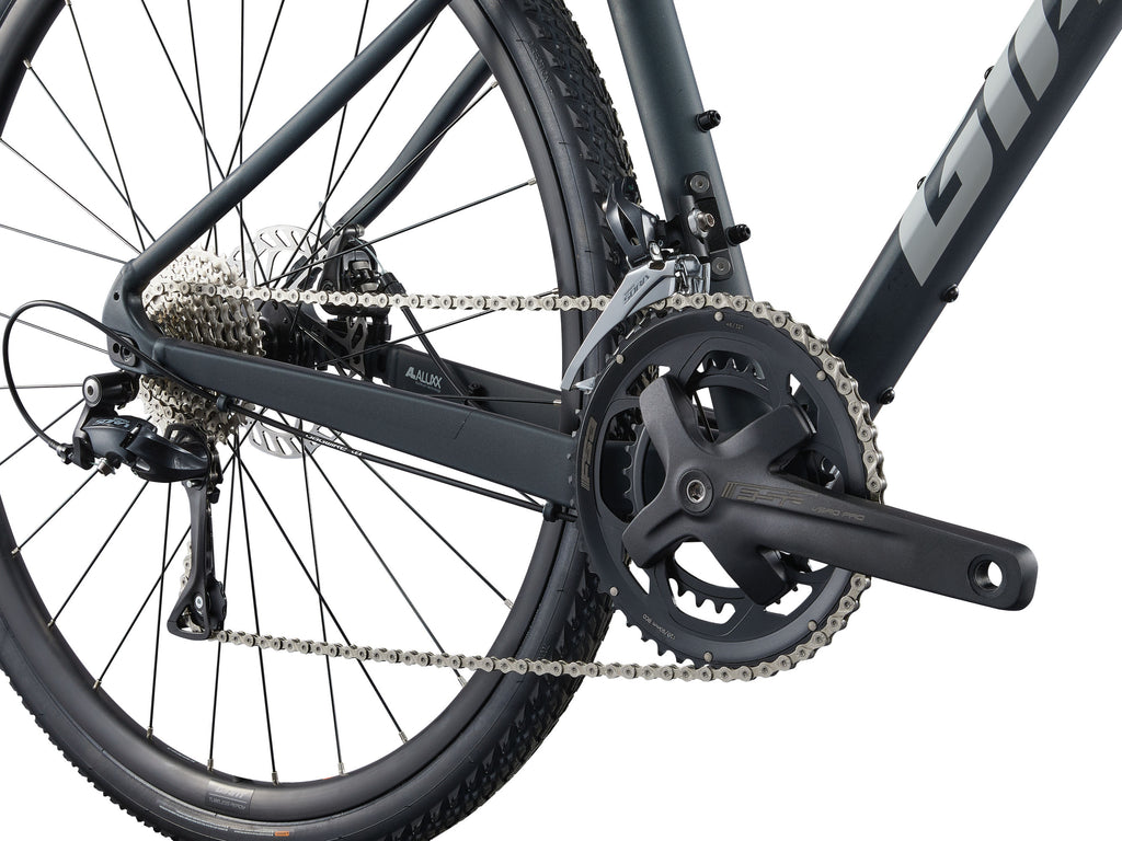 Close-up of a bicycle chain and gear system on a white background