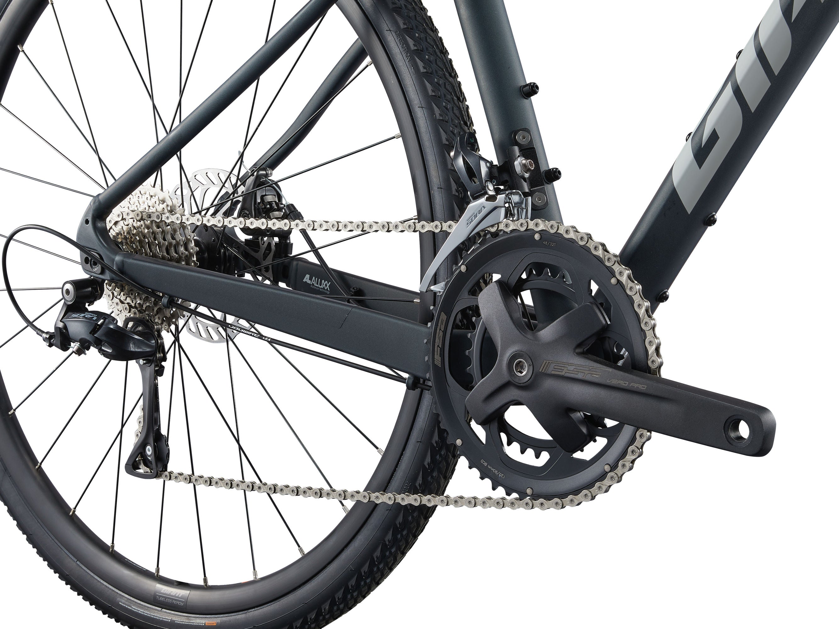 Close-up of a bicycle chain and gear system on a white background