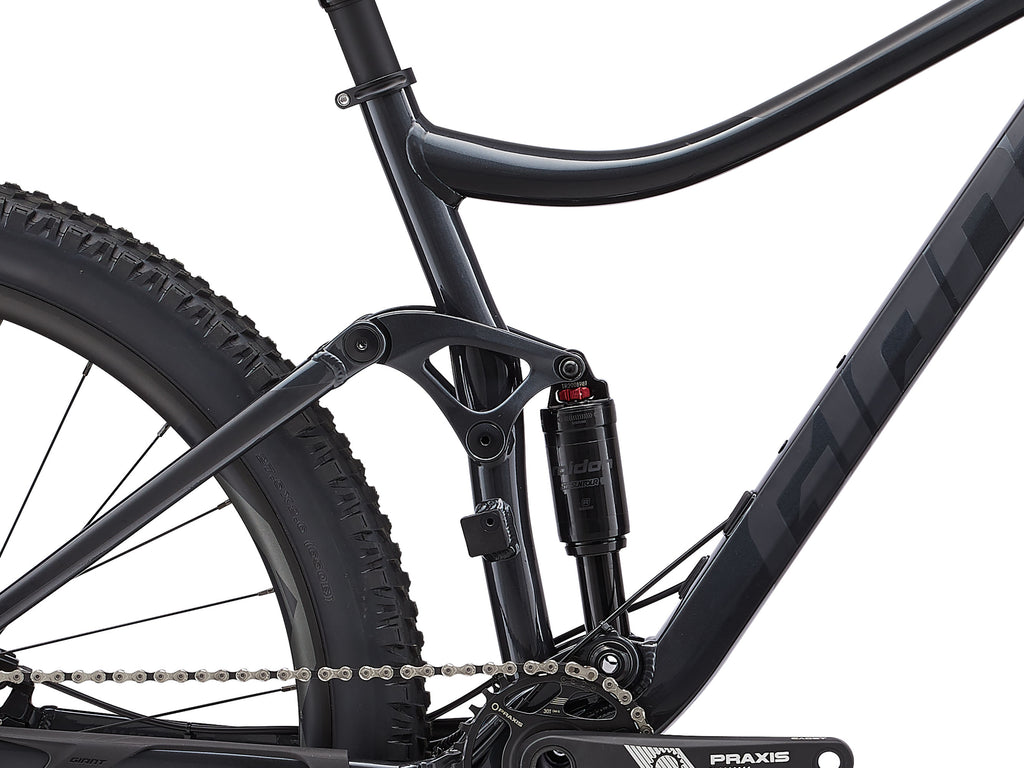 Close-up of a mountain bike with focus on the suspension fork and chain