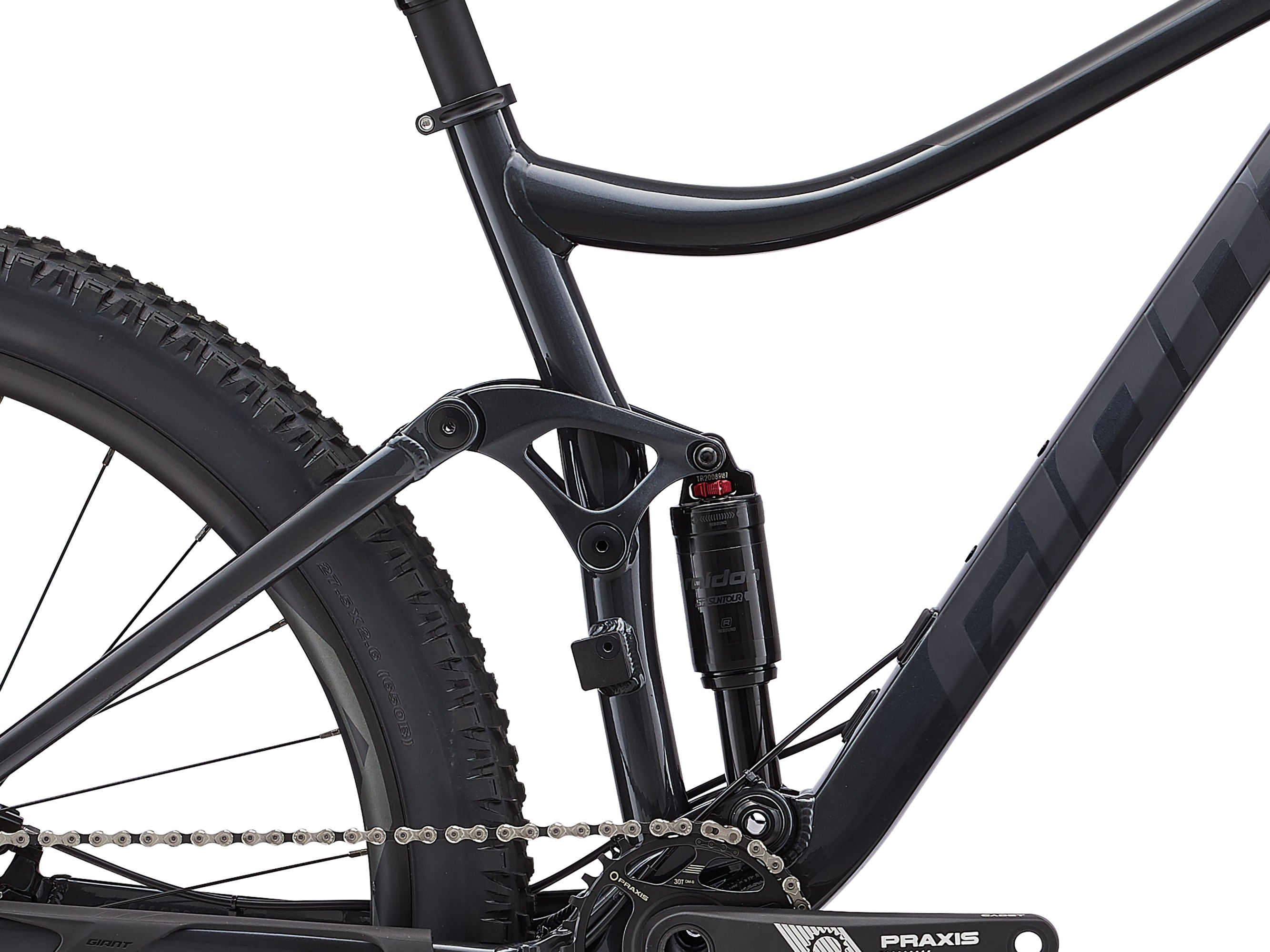 Close-up of a mountain bike with focus on the suspension fork and chain