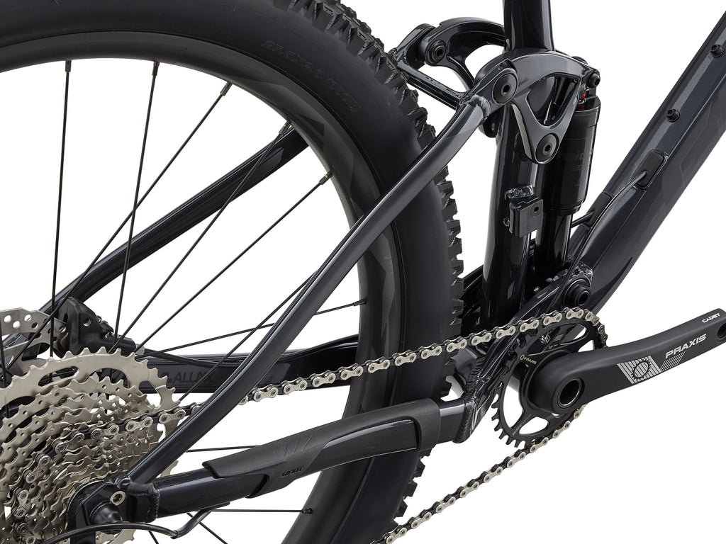 Close-up of a bicycle's chain and gear system on a white background
