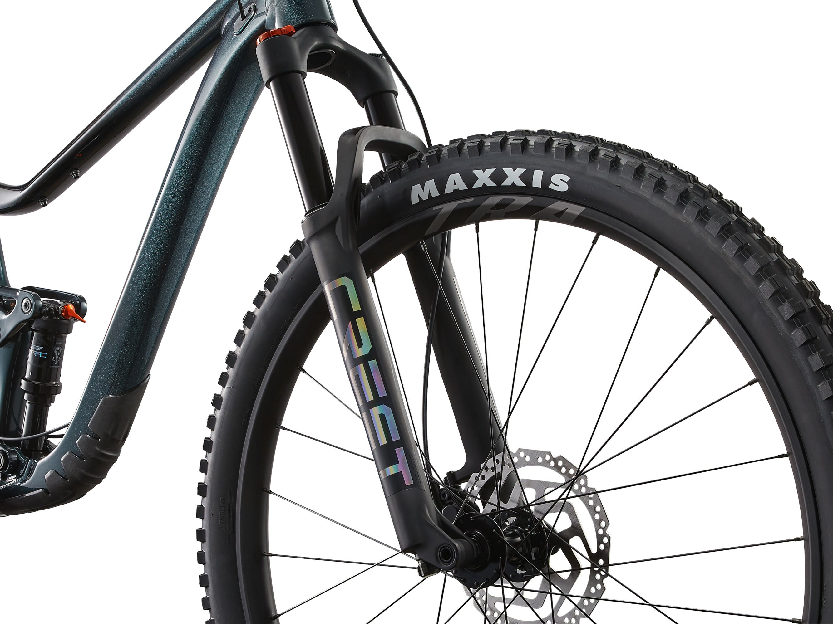 Close-up of a bicycle wheel with Maxxis tire and Coeur suspension fork on a white background