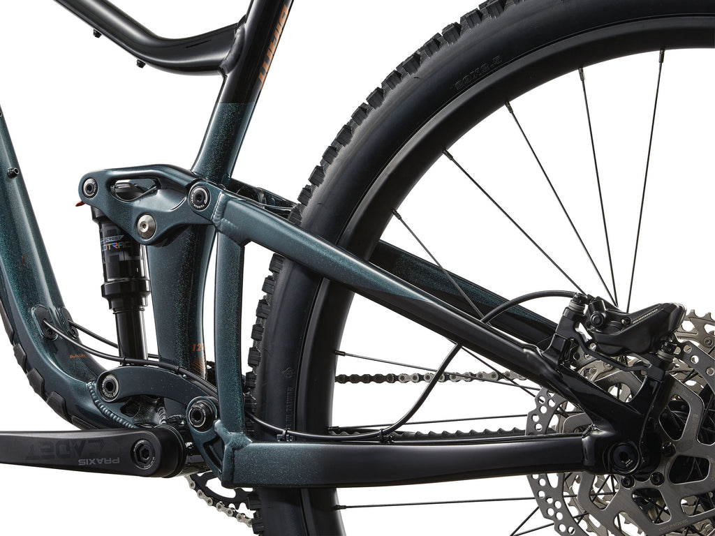 Close-up of a bicycle frame and wheel on a white background