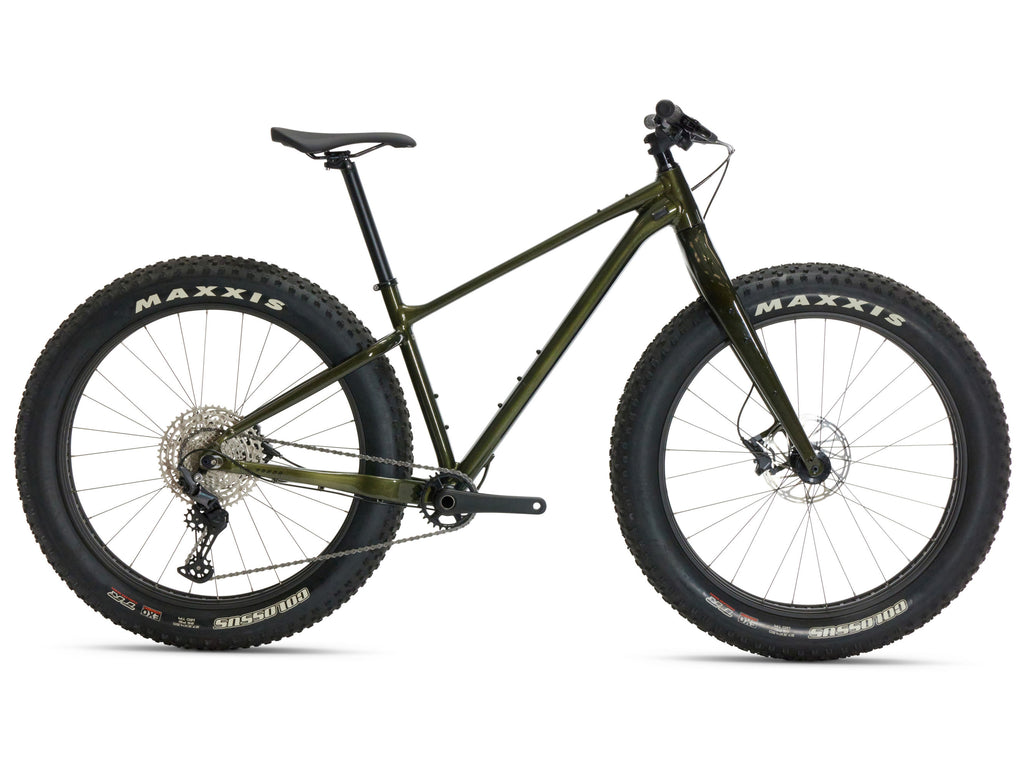 Green fatbike with Maxxis tires on a white background