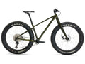 Green fatbike with Maxxis tires on a white background