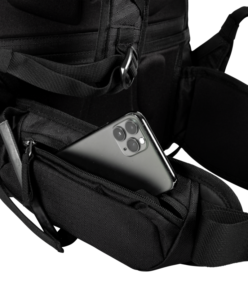 Black backpack with a smartphone inside on a white background