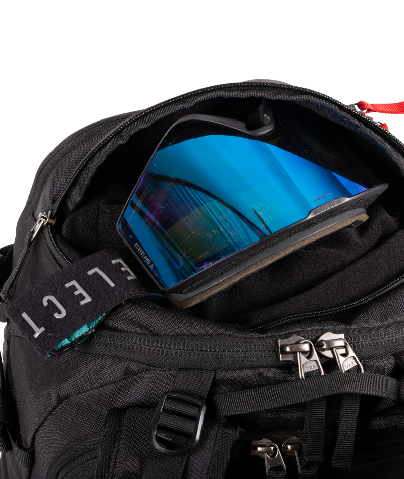 Black backpack with a blue goggle inside.