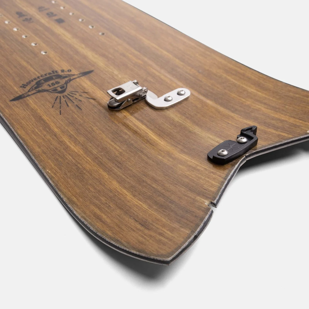 Wooden snowboard with metal clasp on a white background
