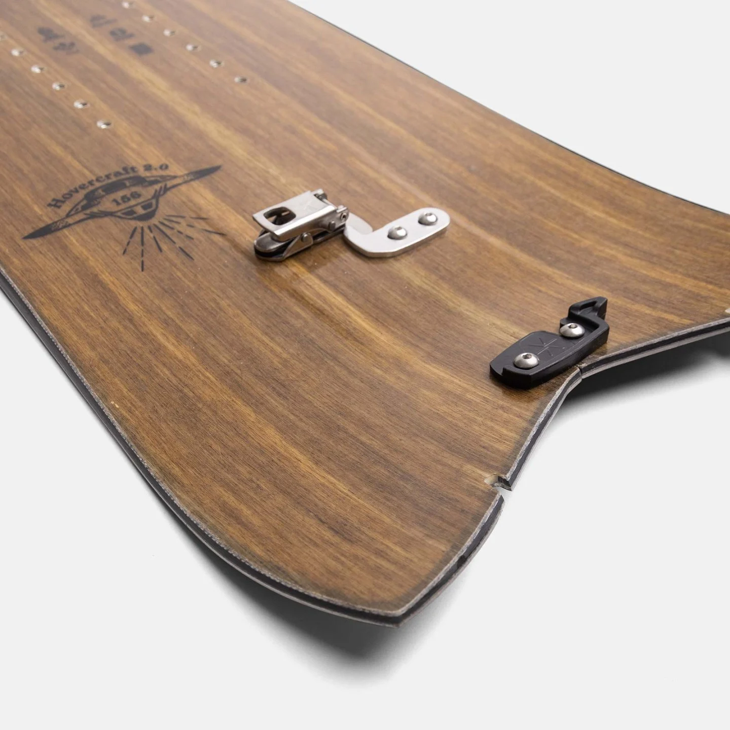 Wooden snowboard with metal clasp on a white background