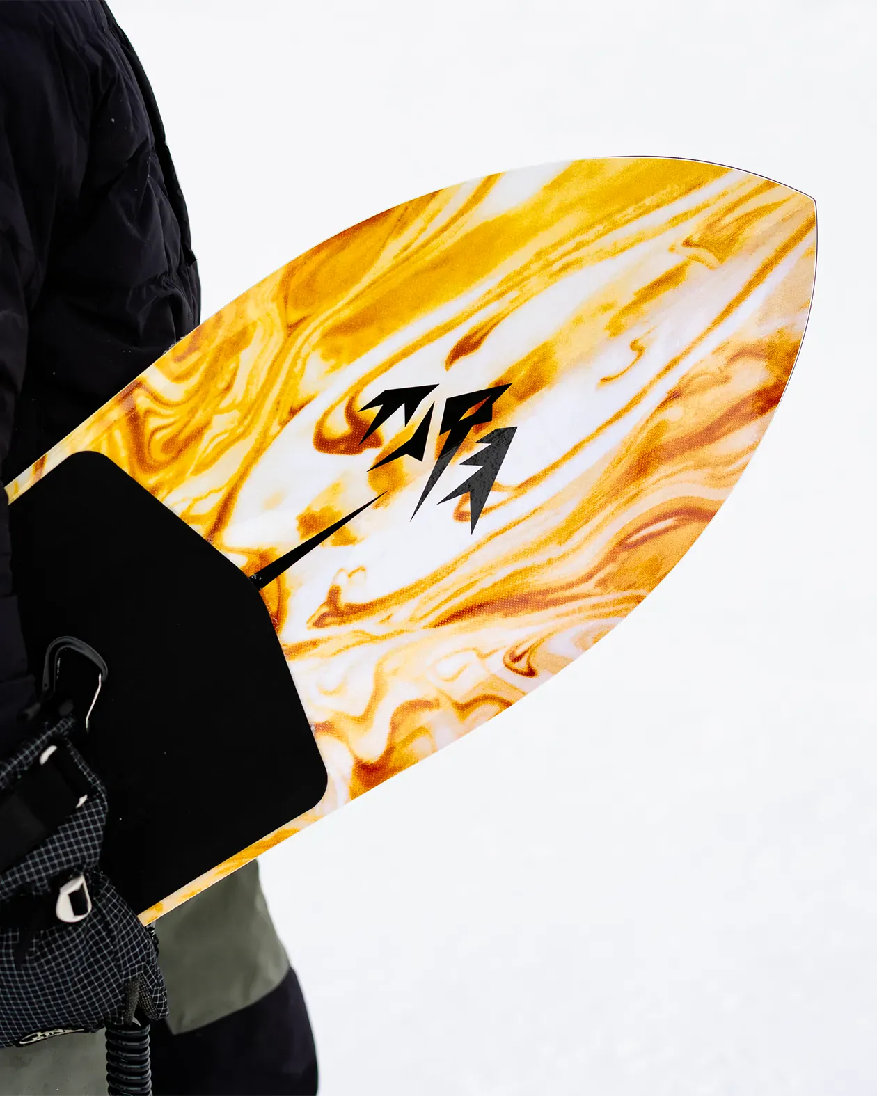 Person holding a yellow and orange surfboard with a black logo on a white background