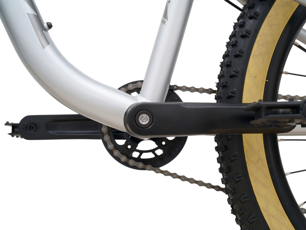 Close-up of a bicycle chain and gear system on a white background