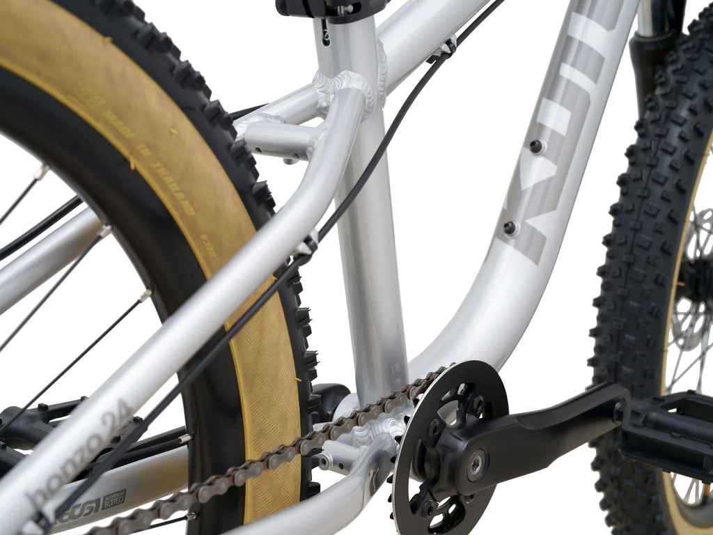 Close-up of a bicycle chain and gear system on a white background