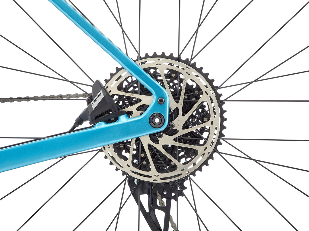 Close-up of a bicycle gear system with a blue frame on a white background