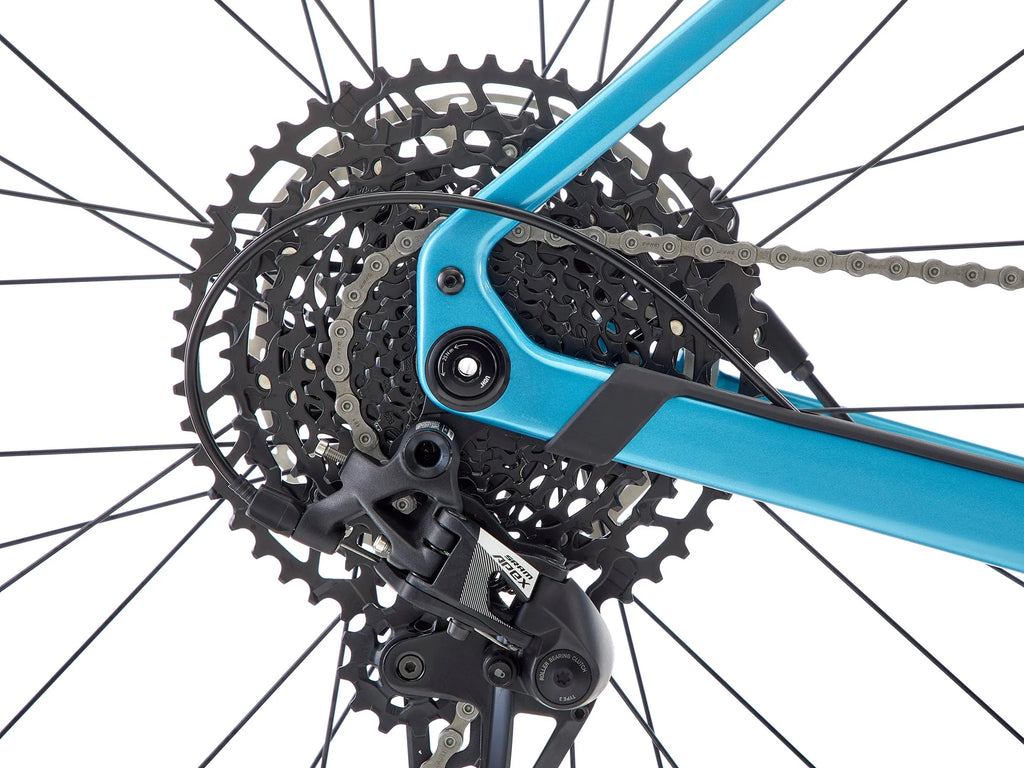Close-up of a bicycle's gear system with a blue frame.