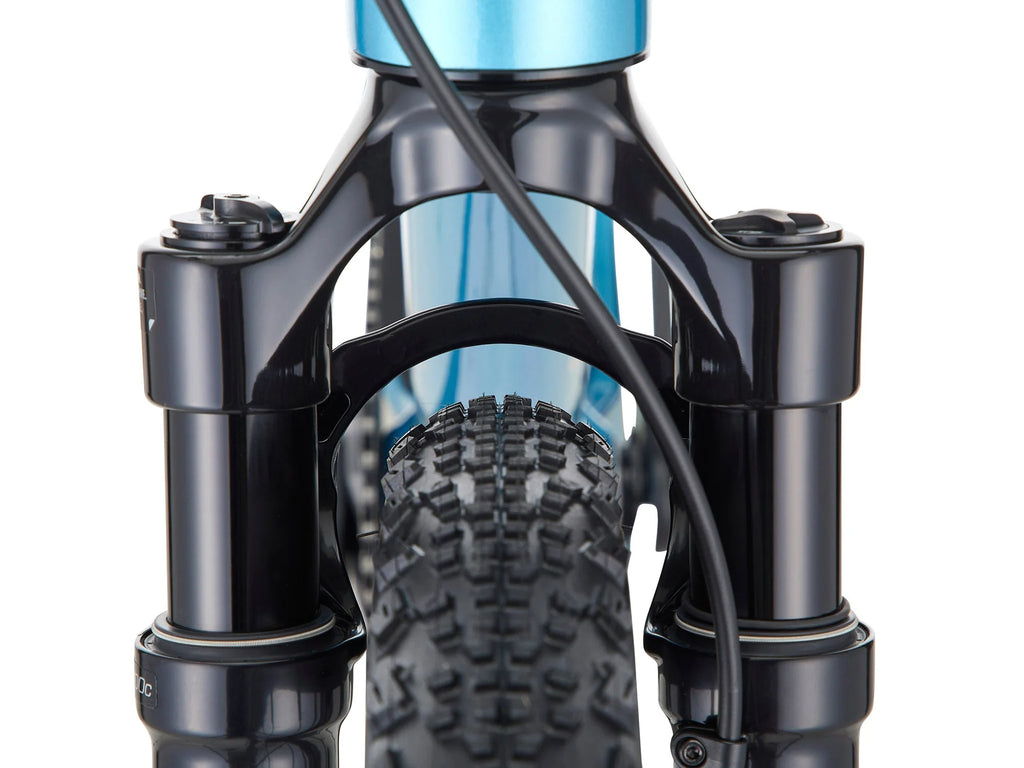 Close-up of a bicycle fork with blue frame and black components on a white background